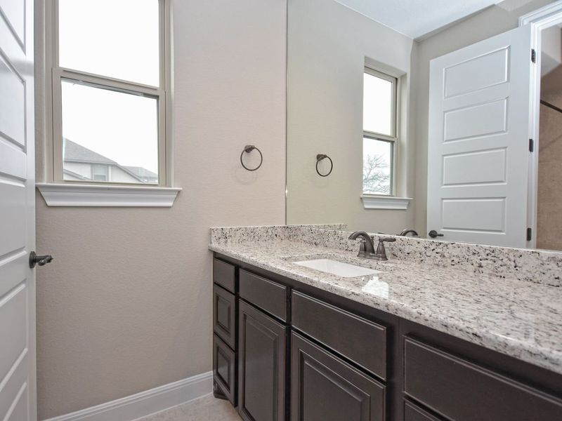 Representative furnished interior of a home built from the Madera II by Giddens Homes in Scofield Farms Estates, Georgetown (Image 217).