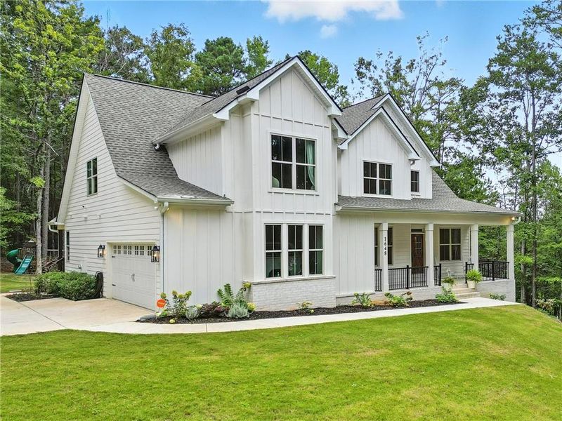 Front exterior of a new home in , Acworth, GA, highlighting curb appeal (Image 27).