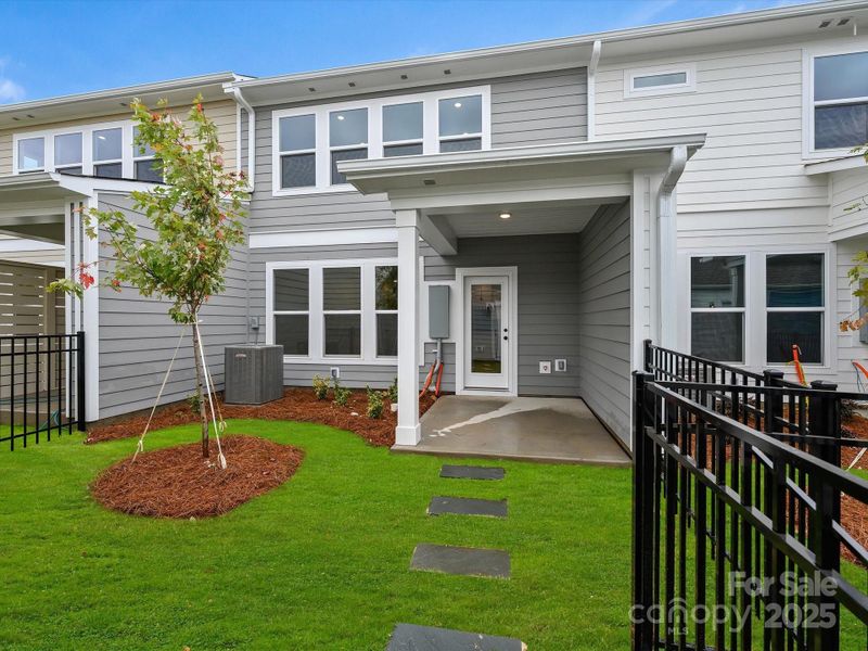 Front exterior of a new home in North Creek Village - Townhomes, Huntersville, NC, highlighting curb appeal (Image 17).