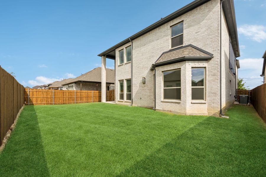 Exterior details and patio area of a home in Country Lakes, Denton (Image 3).