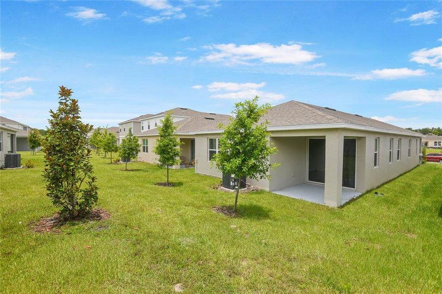 Front exterior of a new home in Seasons at Magnolia Pointe, Umatilla, FL, highlighting curb appeal (Image 15).