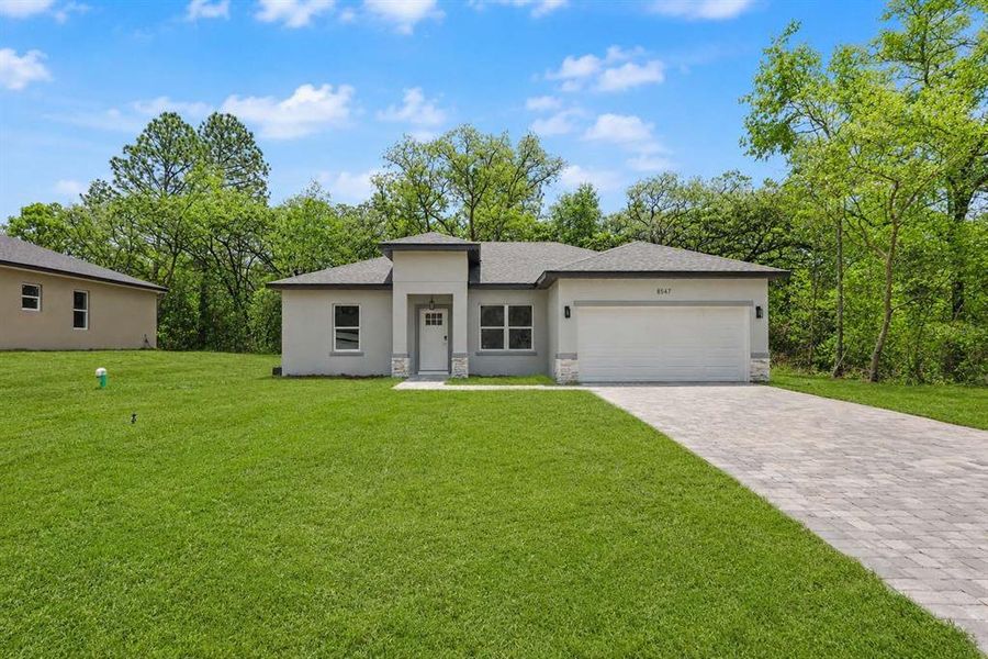 Front exterior of a new home in , Citrus Springs, FL, highlighting curb appeal (Image 20).