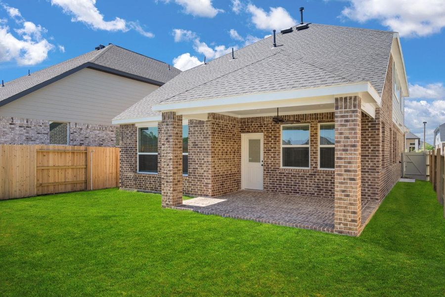 Exterior details and patio area of a home in The Woodlands Hills, Willis (Image 3).