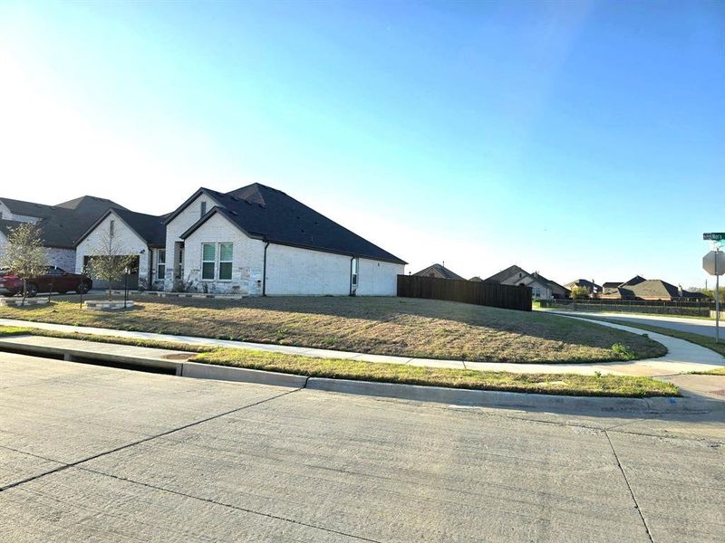 Front exterior of a new home in , Hickory Creek, TX, highlighting curb appeal (Image 28).