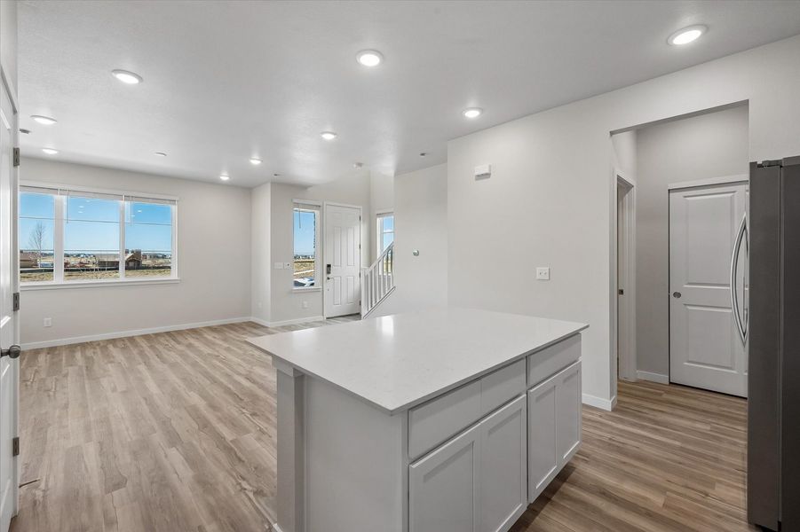 A large kitchen with white cabinets.