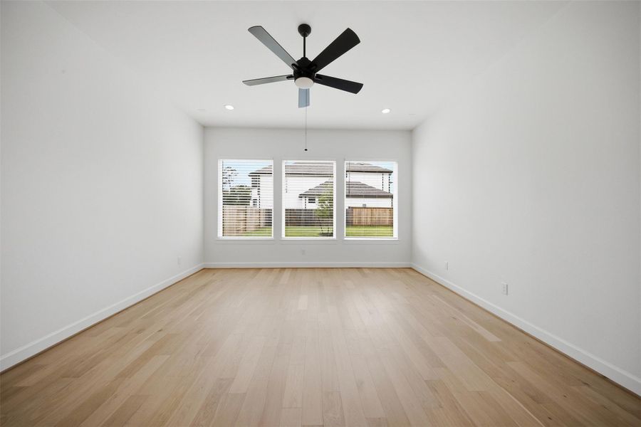 Versatile game room offering ample entertaining space, media potential, and flexible everyday living.