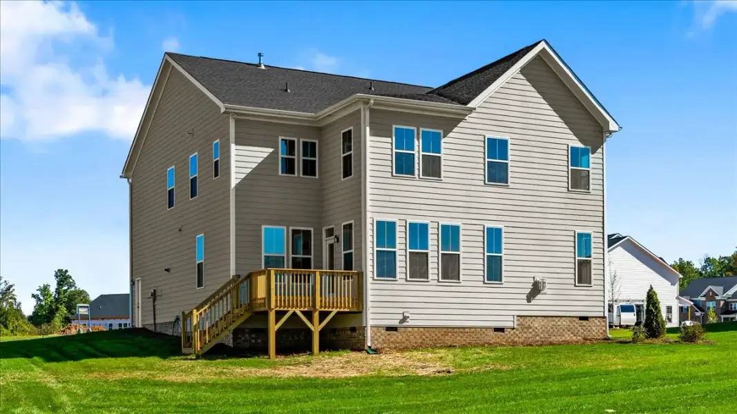 Exterior details and patio area of a home in Lilah Grove, Summerfield (Image 26).