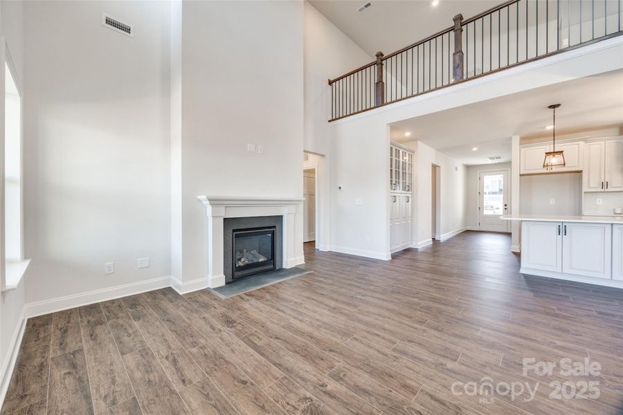 2-story great room with fireplace-yes you can add enhancements such as stone