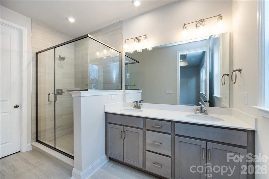 Dual Vanity Primary Bathroom with Walk-In Shower