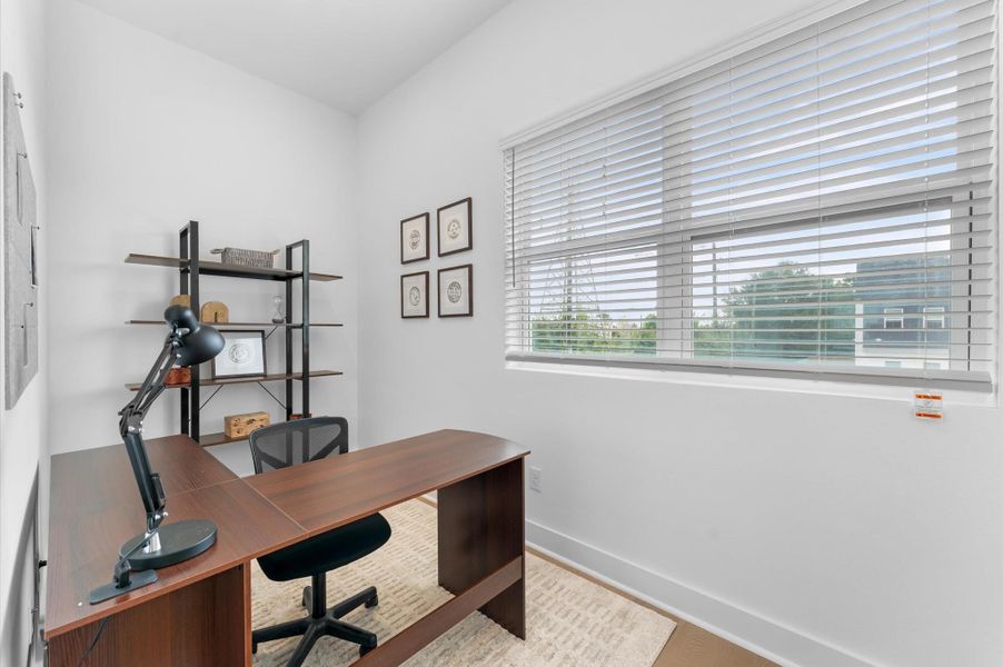 Tucked behind the kitchen on the second floor, this versatile flex room offers endless possibilities—perfect as a home office, gym, or play area for kids making it a valuable extension of the open-concept living space.