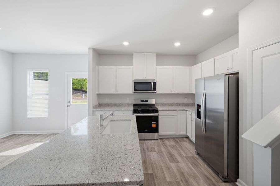 Furnished interior view inside a new home in Carpenter Falls, Durham (Image 7).