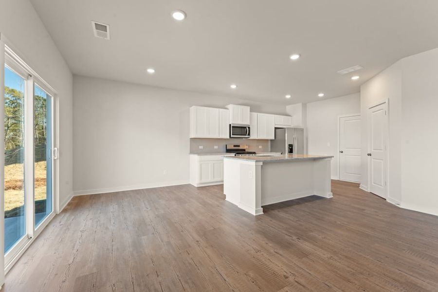 A kitchen with white cabinets. A kitchen with white cabinets.