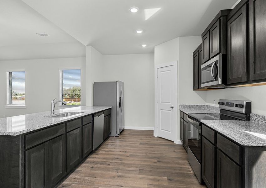 The kitchen has stainless-steel, energy-efficient appliances.