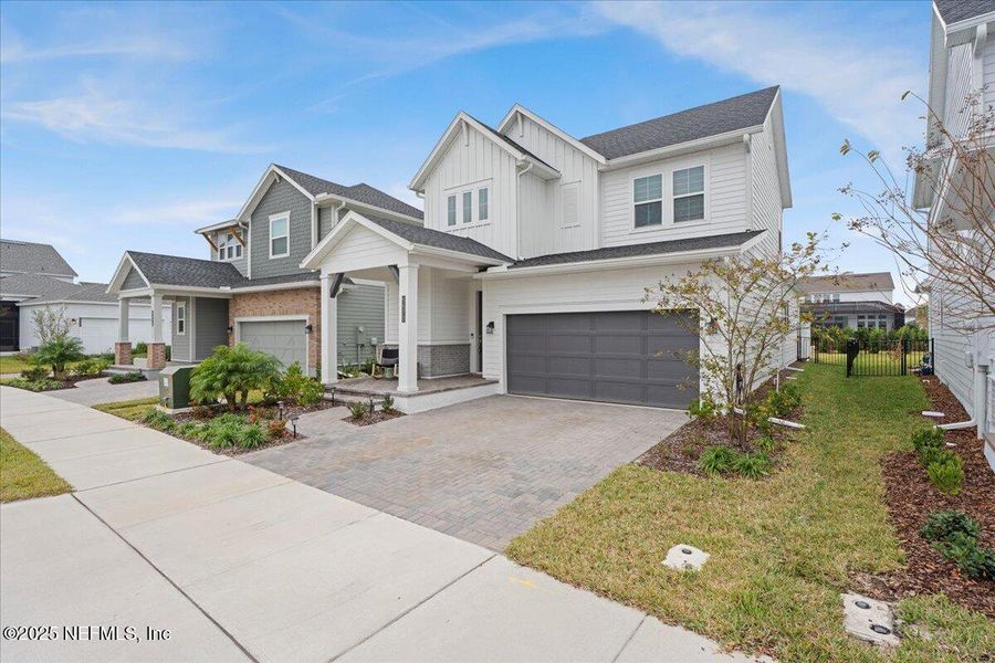Front exterior of a new home in , Jacksonville, FL, highlighting curb appeal (Image 26).