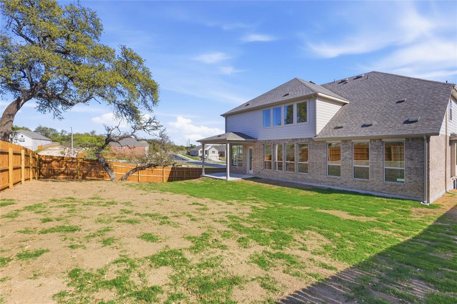 Exterior details and patio area of a home in Retreat at San Gabriel, Georgetown (Image 23).