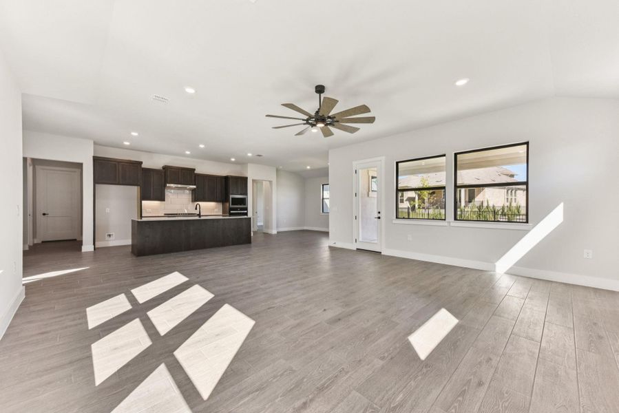 Unfurnished living room with recessed lighting, light wood-style flooring, and ceiling fan Unfurnished living room with recessed lighting, light wood-style flooring, and ceiling fan
