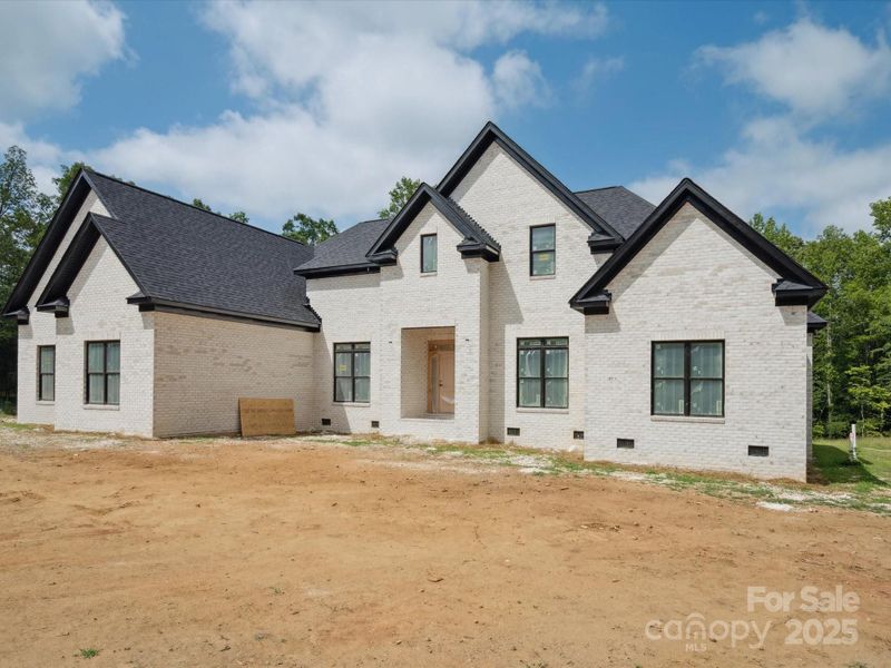 Front exterior of a new home in , Waxhaw, NC, highlighting curb appeal (Image 10).