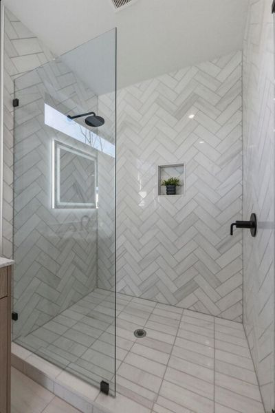 Bathroom featuring a shower stall