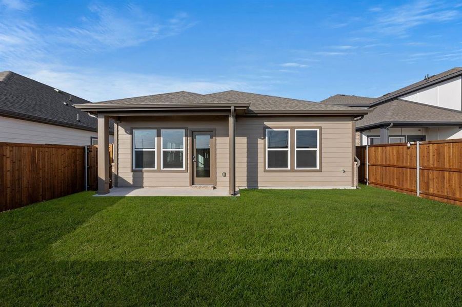 Exterior details and patio area of a home in The Meadows, Krum (Image 3).