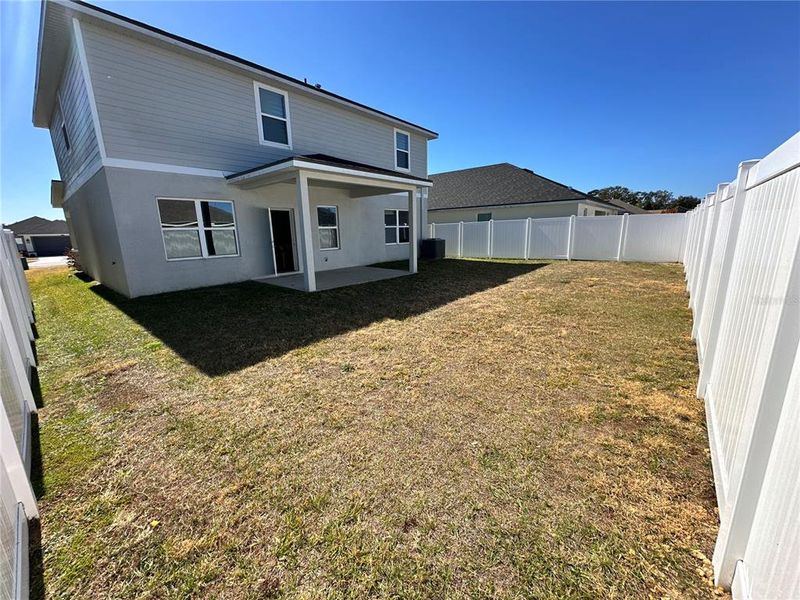 Exterior details and patio area of a home in Abbey Glen, Dade City (Image 3).