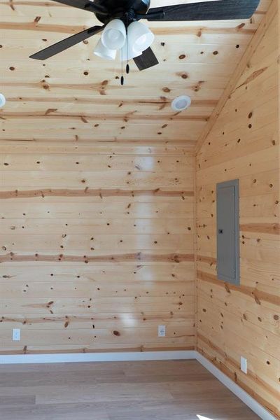 Kitchen view of light wood finished floors and a wall unit AC Kitchen view of light wood finished floors and a wall unit AC