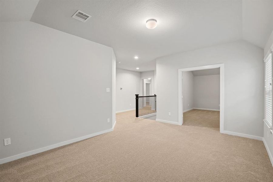 Another view of game room and media room. Sample photo of completed home with similar floor plan. As-built interior colors and selections may vary.