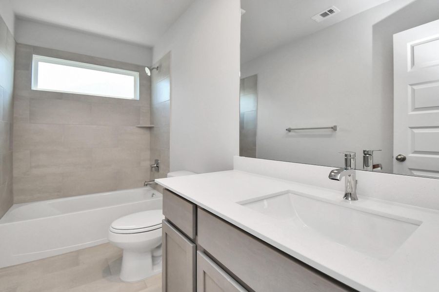 Walk-in closet that epitomizes luxury and practicality. This generously sized space features built-in shelving, offering abundant room for impeccable organization. High ceilings and recessed lighting create a bright and welcoming ambiance. Sample photo of completed home with similar floor plan. Actual colors and selections may vary. Walk-in closet that epitomizes luxury and practicality. This generously sized space features built-in shelving, offering abundant room for impeccable organization. High ceilings and recessed lighting create a bright and welcoming ambiance. Sample photo of completed home with similar floor plan. Actual colors and selections may vary.