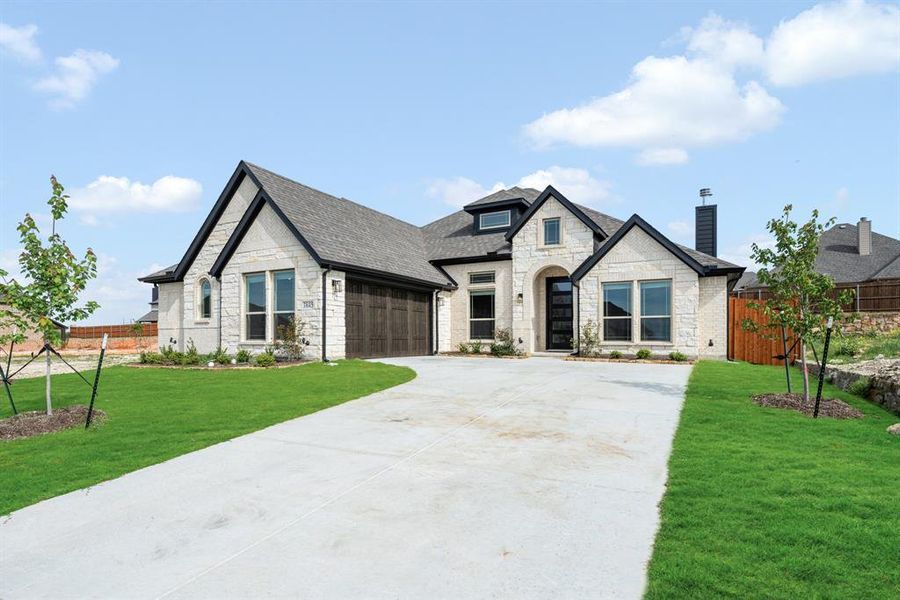 Front exterior of a new home in Villages of Walnut Grove, Midlothian, TX, highlighting curb appeal (Image 2). Front exterior of a new home in Villages of Walnut Grove, Midlothian, TX, highlighting curb appeal (Image 2).