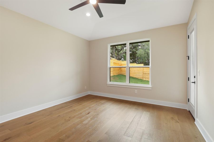 Spare room featuring baseboards, recessed lighting, a ceiling fan, and light wood-style flooring Spare room featuring baseboards, recessed lighting, a ceiling fan, and light wood-style flooring