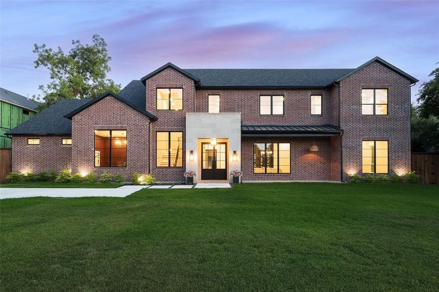 View of front of home with a yard