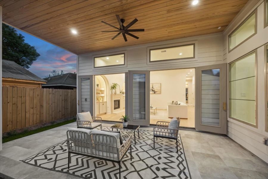 Two French doors open to extend your living space outdoors, creating a seamless setting for entertaining.