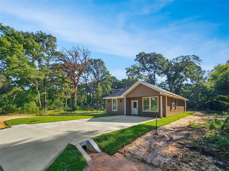 Front exterior of a new home in , Mabank, TX, highlighting curb appeal (Image 2). Front exterior of a new home in , Mabank, TX, highlighting curb appeal (Image 2).