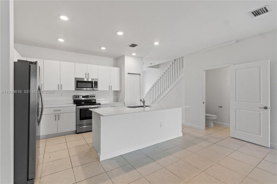 Furnished interior view inside a new home in Harmony Parc, Homestead (Image 5).