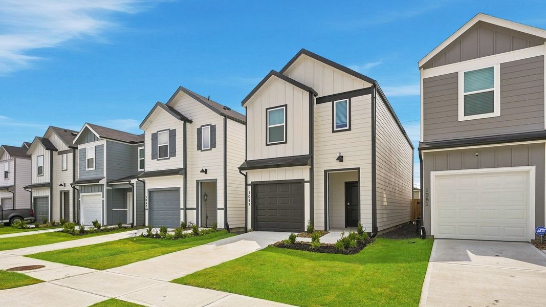 Front exterior of a new home in The Villas at Legacy Park, Houston, TX, highlighting curb appeal (Image 7). Front exterior of a new home in The Villas at Legacy Park, Houston, TX, highlighting curb appeal (Image 7).