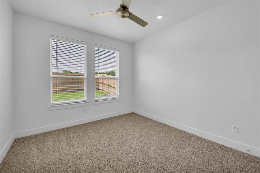 Carpeted empty room with recessed lighting, baseboards, and ceiling fan Carpeted empty room with recessed lighting, baseboards, and ceiling fan