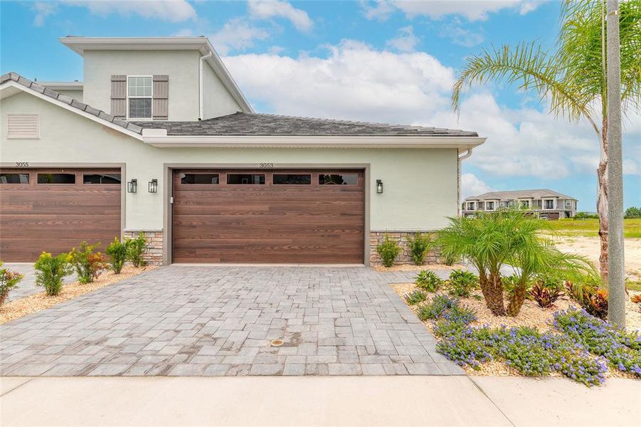 Front exterior of a new home in , New Smyrna Beach, FL, highlighting curb appeal (Image 1). Front exterior of a new home in , New Smyrna Beach, FL, highlighting curb appeal (Image 1).