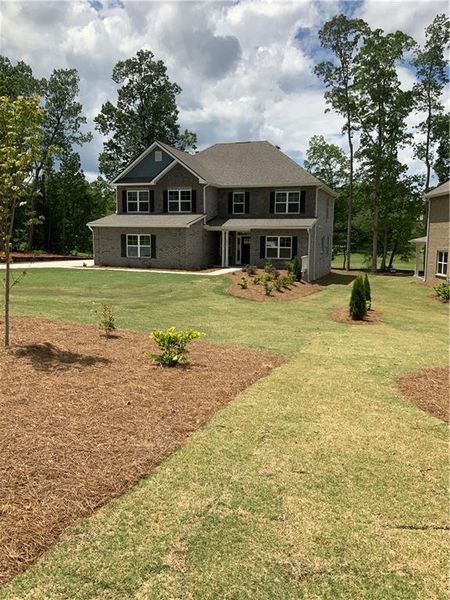Front exterior of a new home in , Villa Rica, GA, highlighting curb appeal (Image 1). Front exterior of a new home in , Villa Rica, GA, highlighting curb appeal (Image 1).