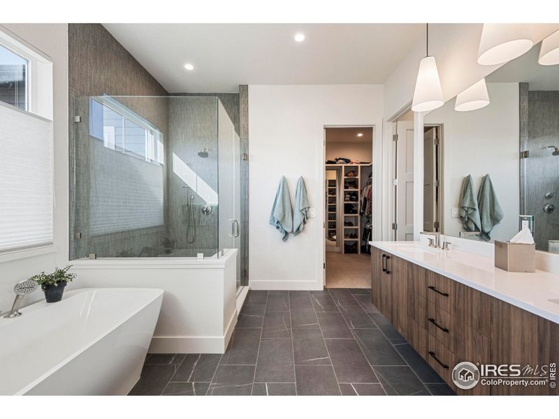 custom cabinets, quartz counter tops, oversized tile flooring, all leading into the walking closet custom cabinets, quartz counter tops, oversized tile flooring, all leading into the walking closet