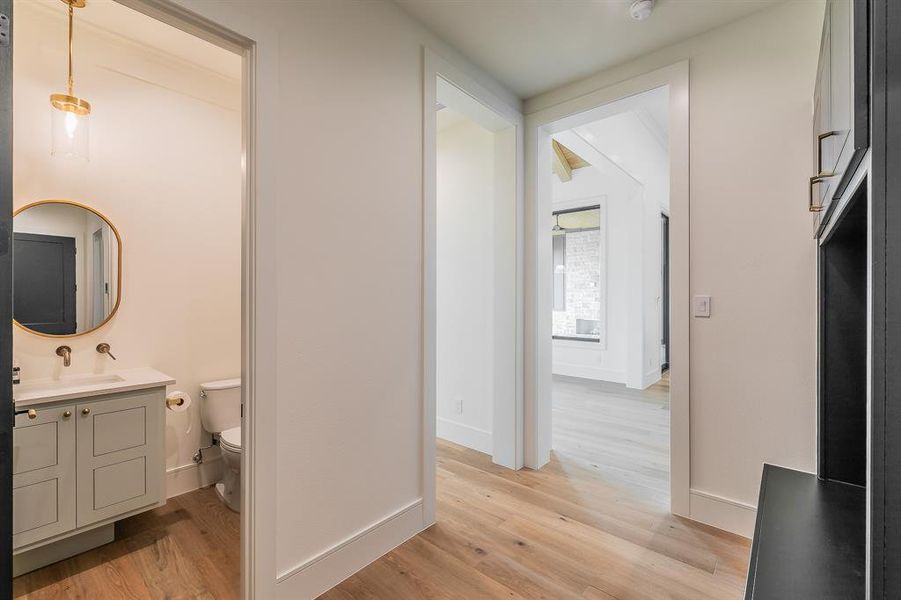 Bathroom with light wood-style floors and vanity
