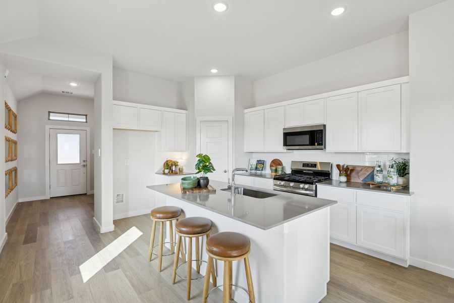 Kitchen in a Nicholson Ranch Magnolia Model Home in Lavon TX by Trophy Signature Homes
