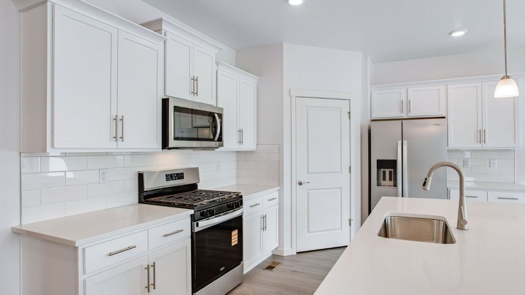 Representative furnished interior of a home built from the Newcastle by D.R. Horton in Tailholt, Severance (Image 4).