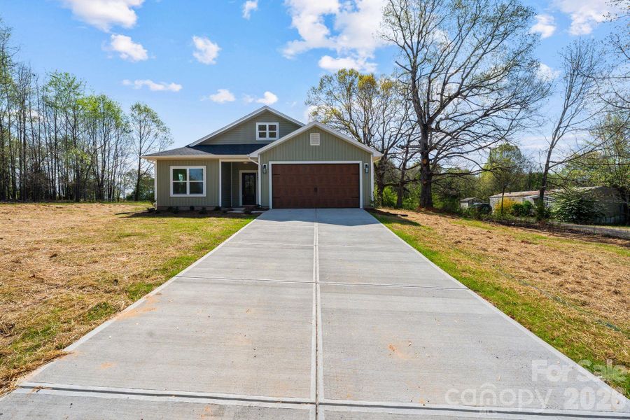 Front exterior of a new home in , Lawndale, NC, highlighting curb appeal (Image 26).