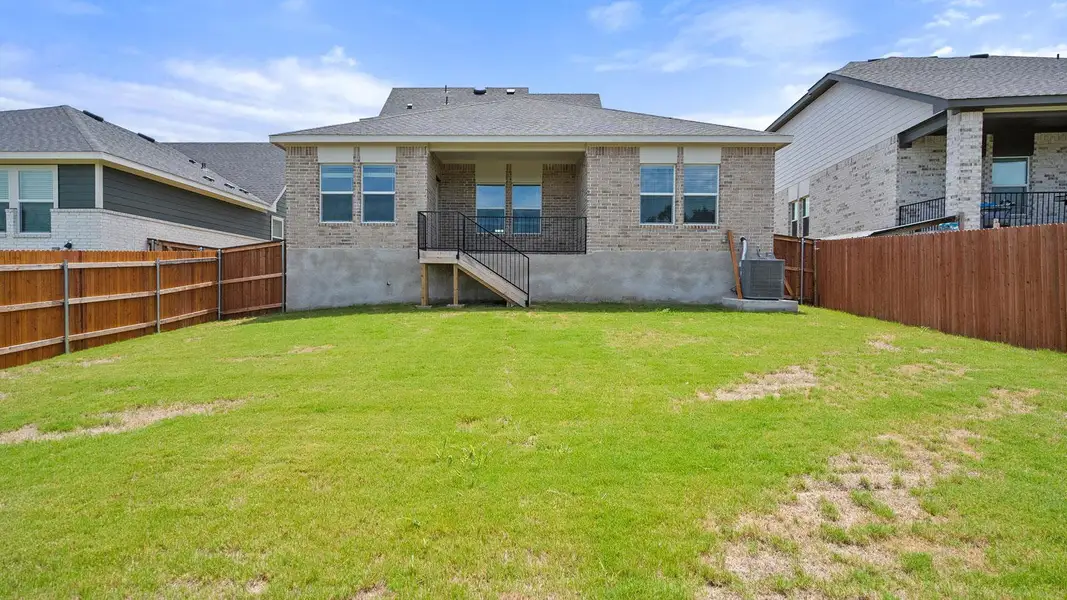 Exterior details and patio area of a home in Thunder Rock, Marble Falls (Image 3).