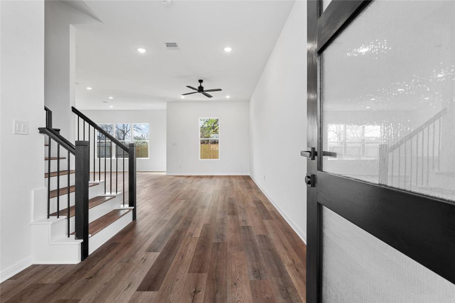 Step inside to a bright and open layout with durable vinyl flooring that flows throughout the home, creating a seamless and inviting feel.
