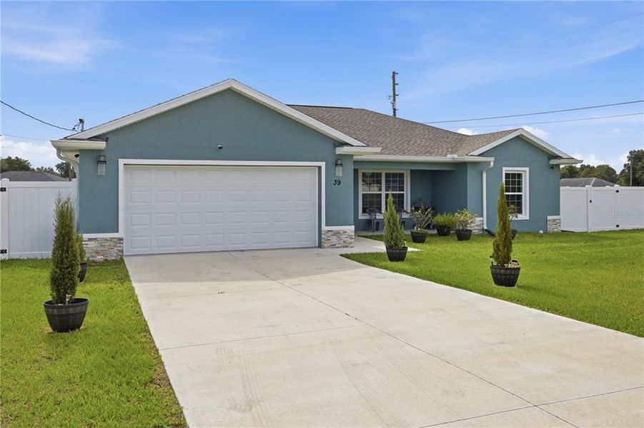 Front exterior of a new home in , Ocala, FL, highlighting curb appeal (Image 2). Front exterior of a new home in , Ocala, FL, highlighting curb appeal (Image 2).
