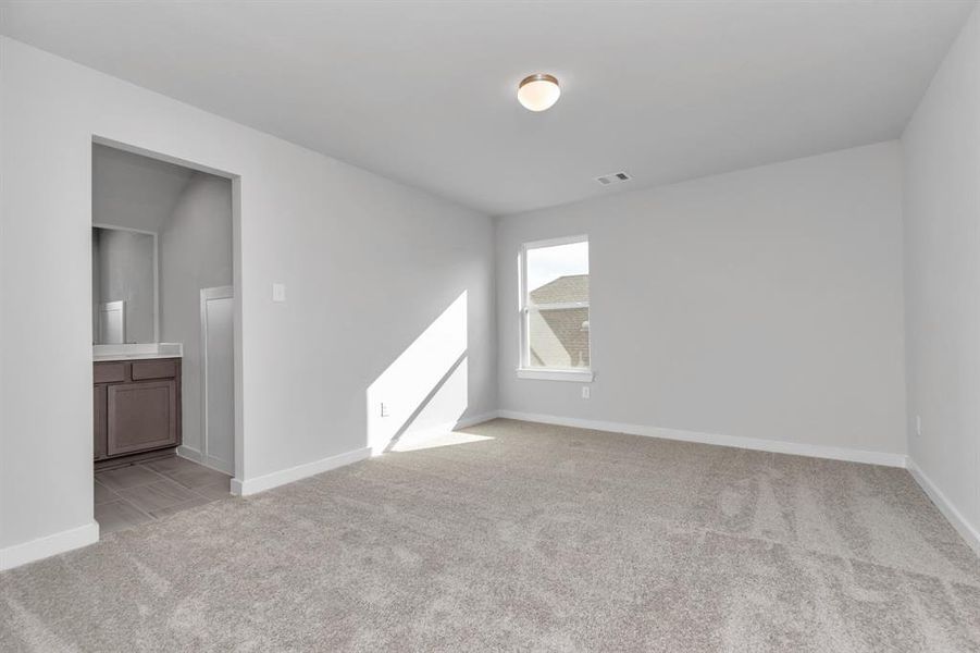 Other bedroom to the jack and jill arrangement. Sample photo of completed home with similar floor plan. As-built interior colors and selections may vary.