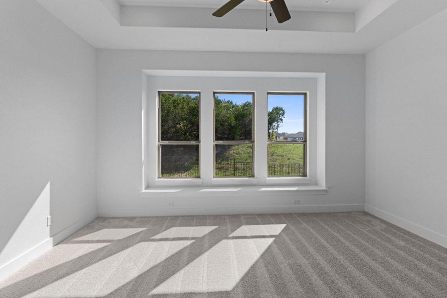 Primary Bedroom with elevated ceiling