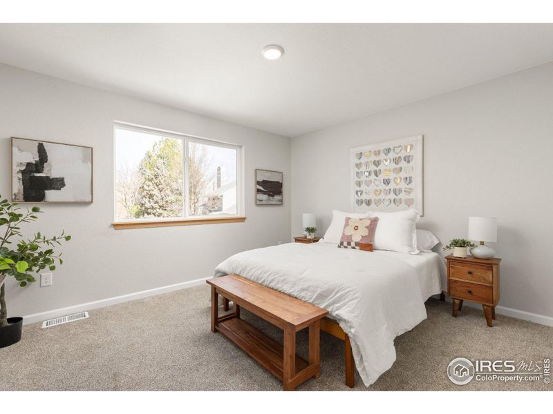 PRIMARY BEDROOM WITH LARGE WINDOW