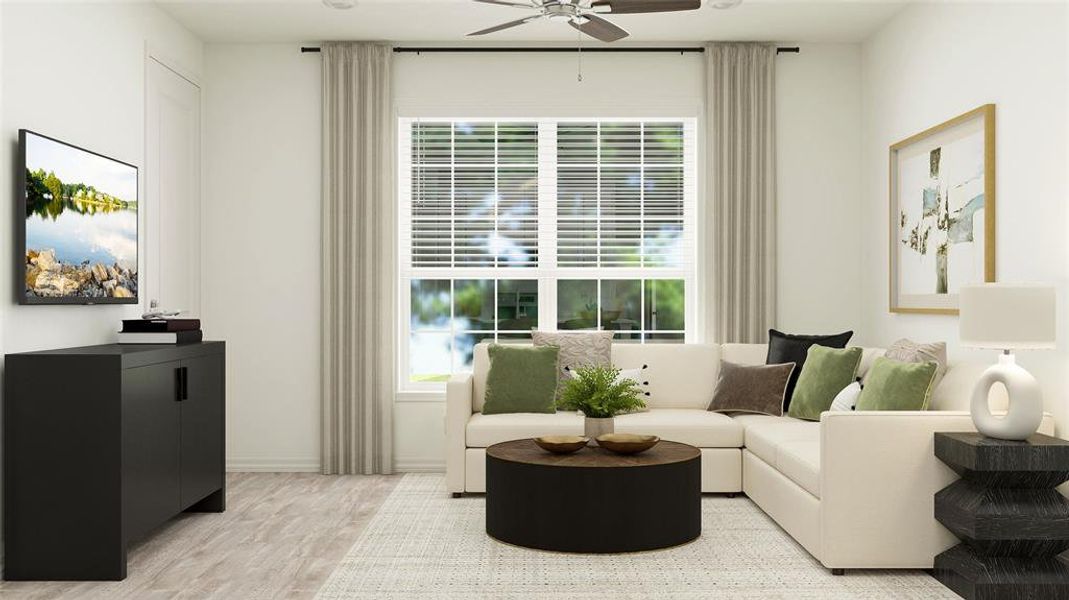 Living room with light wood-type flooring and ceiling fan