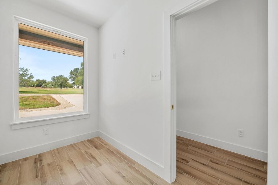 Doorway with baseboards and wood tiled floors Doorway with baseboards and wood tiled floors